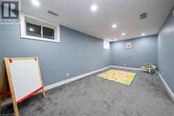 Basement featuring carpet and recessed lighting - 