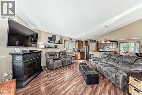 41 Canyoncrest Point W, Lethbridge, AB - Indoor Photo Showing Living Room With Fireplace