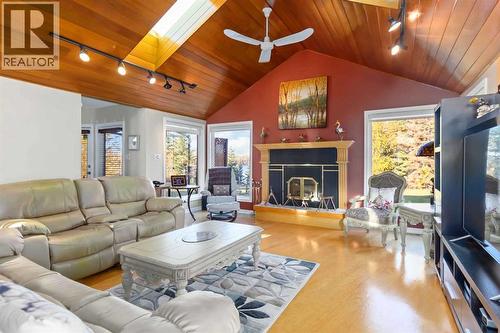 39 Poplar Crescent, Gregoire Lake Estates, AB - Indoor Photo Showing Living Room With Fireplace