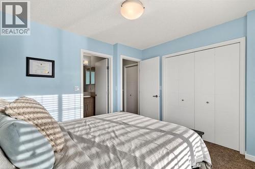330 Marquis Lane Se, Calgary, AB - Indoor Photo Showing Bedroom