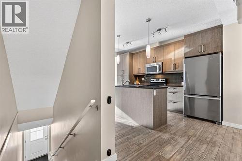 330 Marquis Lane Se, Calgary, AB - Indoor Photo Showing Kitchen With Stainless Steel Kitchen