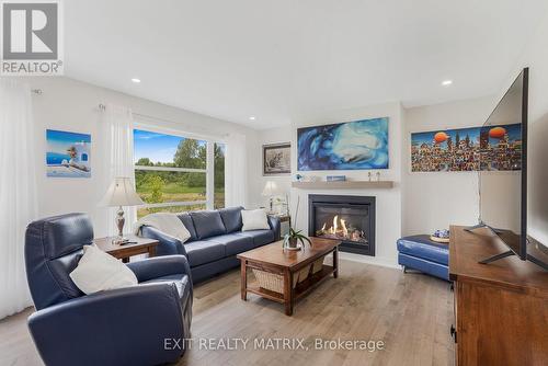 521 Barrage Street, Casselman, ON - Indoor Photo Showing Living Room With Fireplace