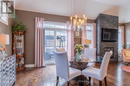 Dining area can easily accommodate an 8 person tab - 1534 Haist Street, Pelham (Fonthill), ON - Indoor Photo Showing Dining Room With Fireplace