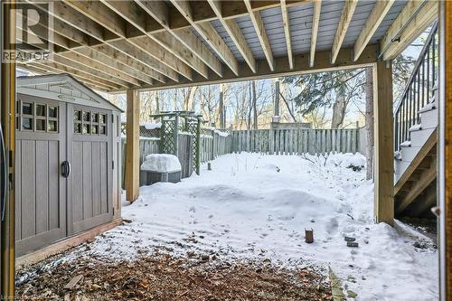 Yard layered in snow with a fenced backyard, a storage shed, and stairway - 1489 Litchfield Road, Oakville, ON - Outdoor