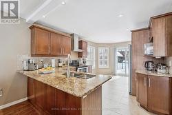 Gourmet Kitchen Equipped with Granite Countertops - 