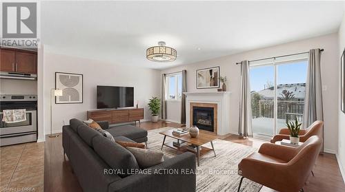 28 Mansfield Drive, Brant, ON - Indoor Photo Showing Living Room With Fireplace