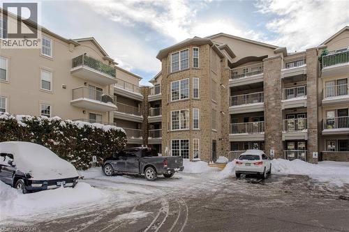 1450 Bishops Gate Unit# 401, Oakville, ON - Outdoor With Balcony With Facade