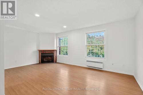 9 Moorside Private, Ottawa, ON - Indoor Photo Showing Living Room With Fireplace