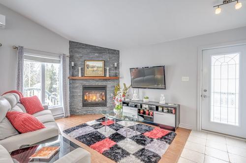 Living room - 2013 Ch. Des Habitations-Des-Monts, Saint-Sauveur, QC - Indoor Photo Showing Living Room With Fireplace