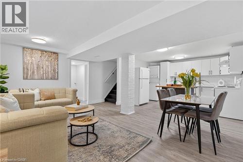 Living area with light wood-style flooring, stairs, and washer / dryer - 146 Appalachian Crescent Unit# Lower, Kitchener, ON - Indoor