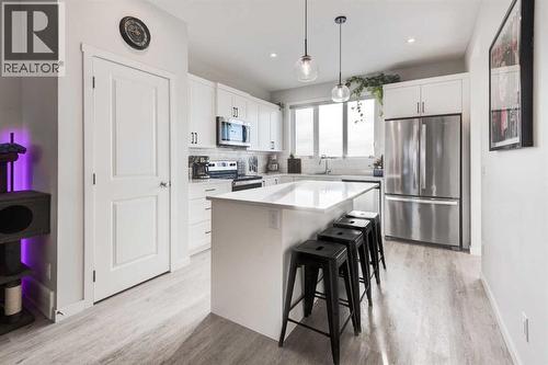 Breakfast Bar - 1969 Rangeview Drive Se, Calgary, AB - Indoor Photo Showing Kitchen With Stainless Steel Kitchen With Upgraded Kitchen