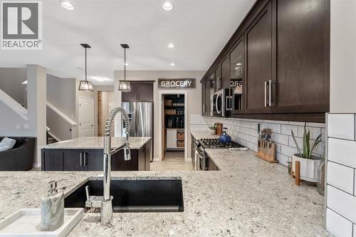 159 Riviera View, Cochrane, AB - Indoor Photo Showing Kitchen With Upgraded Kitchen