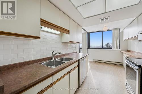 Functional Kitchen w/Stainless Steel Appliances - 702 - 1240 Marlborough Court, Oakville, ON - Indoor Photo Showing Kitchen With Double Sink