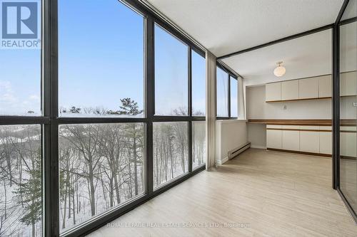 Expansive Windows Invite the Outdoors In - 702 - 1240 Marlborough Court, Oakville, ON - Indoor Photo Showing Other Room