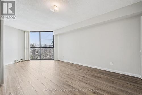 Spacious Bedroom w/New Engineered Hardwood Floor - 702 - 1240 Marlborough Court, Oakville, ON - Indoor Photo Showing Other Room