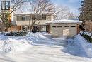 View of front of home featuring brick siding, an attached garage, and driveway - 4226 Dunvegan Road, Burlington, ON  - Outdoor 