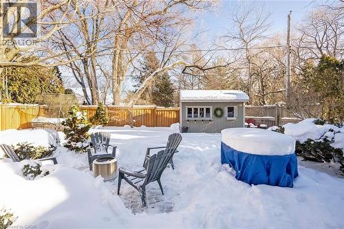 Fenced backyard with an outdoor structure - 4226 Dunvegan Road, Burlington, ON - Outdoor With Deck Patio Veranda