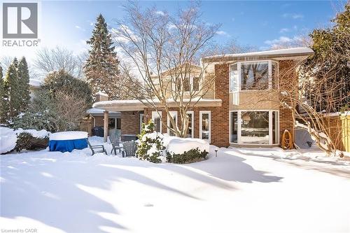 Snow covered back of property with brick siding - 4226 Dunvegan Road, Burlington, ON - Outdoor