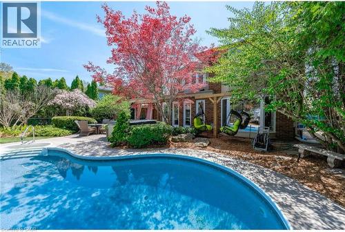 Swimming pool with a patio area - 4226 Dunvegan Road, Burlington, ON - Outdoor With In Ground Pool With Backyard