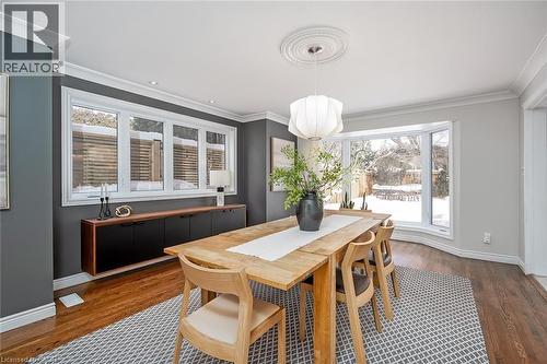 Dining area with crown molding and wood finished floors - 4226 Dunvegan Road, Burlington, ON - Indoor Photo Showing Dining Room