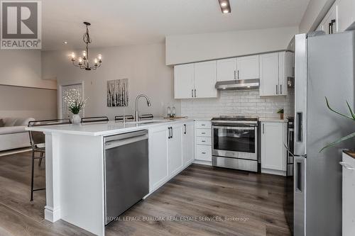 401 - 1450 Bishops Gate, Oakville, ON - Indoor Photo Showing Kitchen With Stainless Steel Kitchen With Upgraded Kitchen