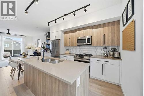 93 Walgrove Common Se, Calgary, AB - Indoor Photo Showing Kitchen With Stainless Steel Kitchen With Double Sink With Upgraded Kitchen