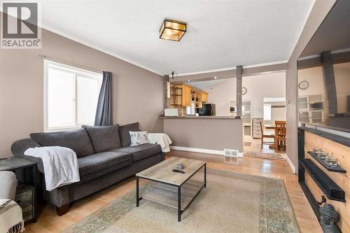 1255 Yuill Street Se, Medicine Hat, AB - Indoor Photo Showing Living Room With Fireplace