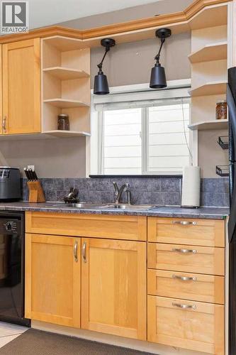 1255 Yuill Street Se, Medicine Hat, AB - Indoor Photo Showing Kitchen With Double Sink