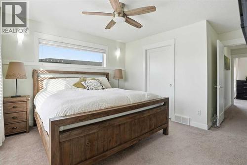 Primary suite - 70, 111 Rainbow Falls Gate, Chestermere, AB - Indoor Photo Showing Bedroom