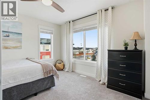 Second bedroom suite - 70, 111 Rainbow Falls Gate, Chestermere, AB - Indoor Photo Showing Bedroom
