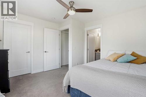 Second bedroom suite - 70, 111 Rainbow Falls Gate, Chestermere, AB - Indoor Photo Showing Bedroom