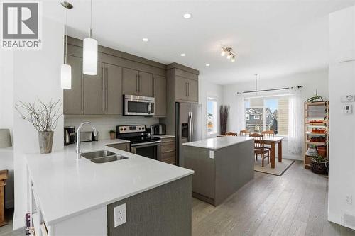 Kitchen - 70, 111 Rainbow Falls Gate, Chestermere, AB - Indoor Photo Showing Kitchen With Stainless Steel Kitchen With Double Sink With Upgraded Kitchen