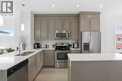 Kitchen - 70, 111 Rainbow Falls Gate, Chestermere, AB - Indoor Photo Showing Kitchen With Stainless Steel Kitchen With Double Sink With Upgraded Kitchen