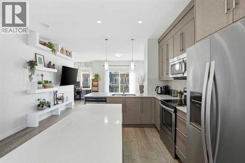 Kitchen - 70, 111 Rainbow Falls Gate, Chestermere, AB - Indoor Photo Showing Kitchen With Stainless Steel Kitchen With Double Sink With Upgraded Kitchen