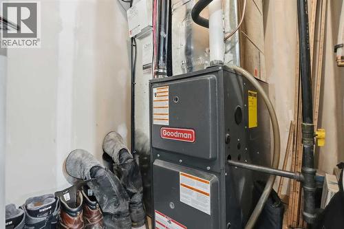 Utility room - 70, 111 Rainbow Falls Gate, Chestermere, AB - Indoor Photo Showing Basement