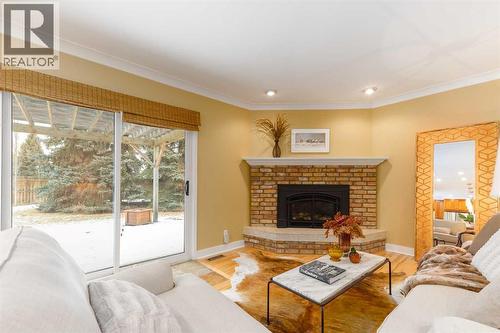 6701 Laird Court Sw, Calgary, AB - Indoor Photo Showing Living Room With Fireplace