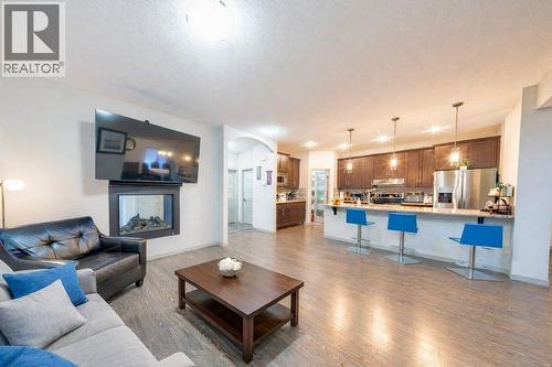 78 Caribou Crescent, Red Deer, AB - Indoor Photo Showing Living Room With Fireplace