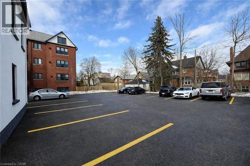 Uncovered parking lot with a residential view - 44 Weber Street W, Kitchener, ON - Outdoor