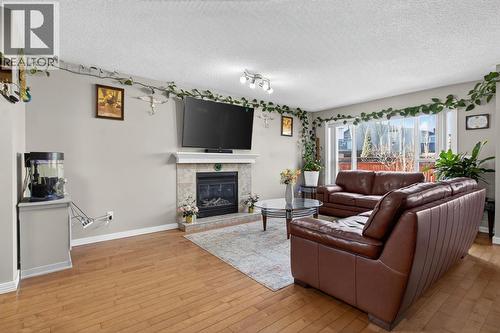 115 Covemeadow Court Ne, Calgary, AB - Indoor Photo Showing Living Room With Fireplace