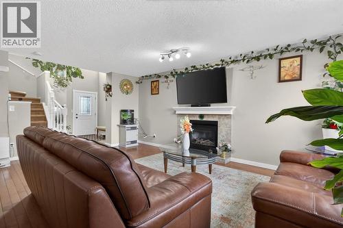 115 Covemeadow Court Ne, Calgary, AB - Indoor Photo Showing Living Room With Fireplace