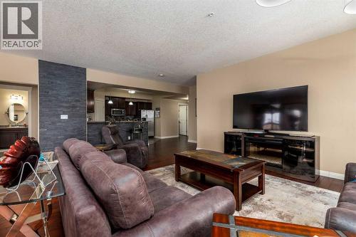 328, 4102 69 Avenue, Lloydminster, AB - Indoor Photo Showing Living Room