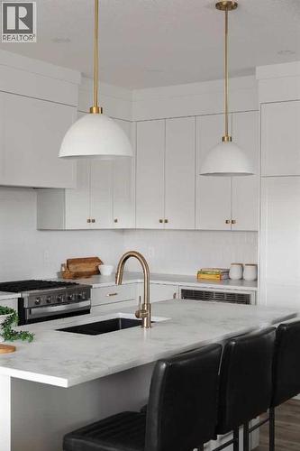 88 Sunrise Heath, Cochrane, AB - Indoor Photo Showing Kitchen With Upgraded Kitchen