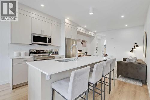 109 & 102, 3550 45 Street Sw, Calgary, AB - Indoor Photo Showing Kitchen With Stainless Steel Kitchen With Double Sink With Upgraded Kitchen