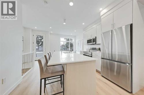 101, 3550 45 Street Sw, Calgary, AB - Indoor Photo Showing Kitchen With Stainless Steel Kitchen With Upgraded Kitchen