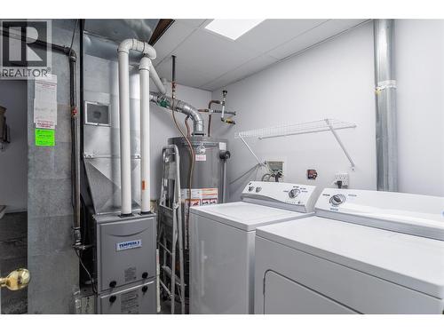 lower level private laundry - 885 Walrod Street, Kelowna, BC - Indoor Photo Showing Laundry Room