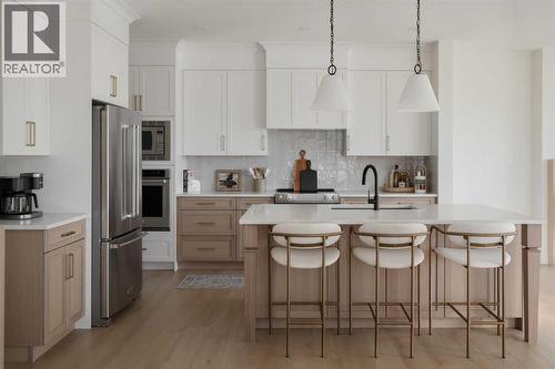 28 Sunvalley View, Cochrane, AB - Indoor Photo Showing Kitchen With Stainless Steel Kitchen With Upgraded Kitchen