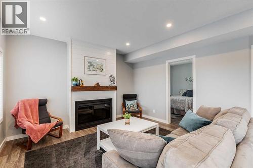 Electric Fireplace with Heater - 382 Williamstown Green Nw, Airdrie, AB - Indoor Photo Showing Living Room With Fireplace