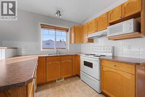 272 Chaparral Drive Se, Calgary, AB - Indoor Photo Showing Kitchen With Double Sink
