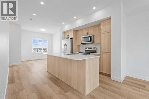 1506, 25 Wildwoods Court Sw, Airdrie, AB - Indoor Photo Showing Kitchen With Upgraded Kitchen