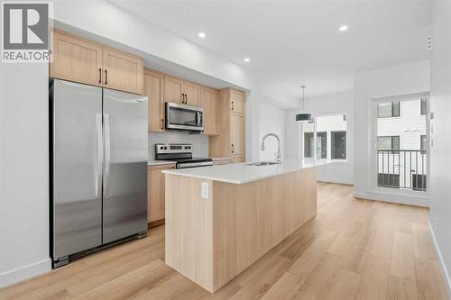 1506, 25 Wildwoods Court Sw, Airdrie, AB - Indoor Photo Showing Kitchen With Stainless Steel Kitchen With Upgraded Kitchen